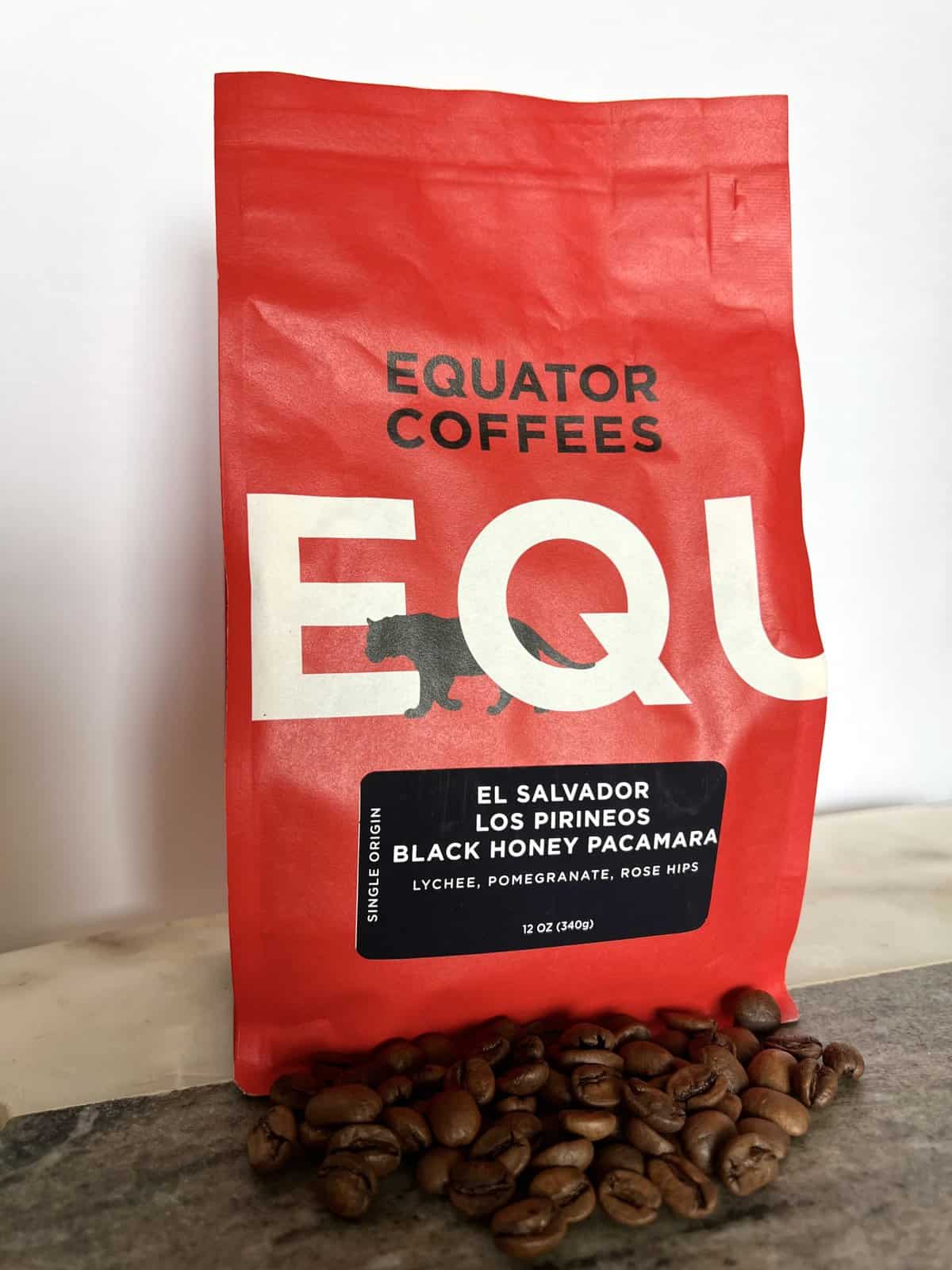 Fellow Coffee Subscription Review: Deliveries Designed To Educate 4 Equator Coffee packaging stands on coffee beans scaled