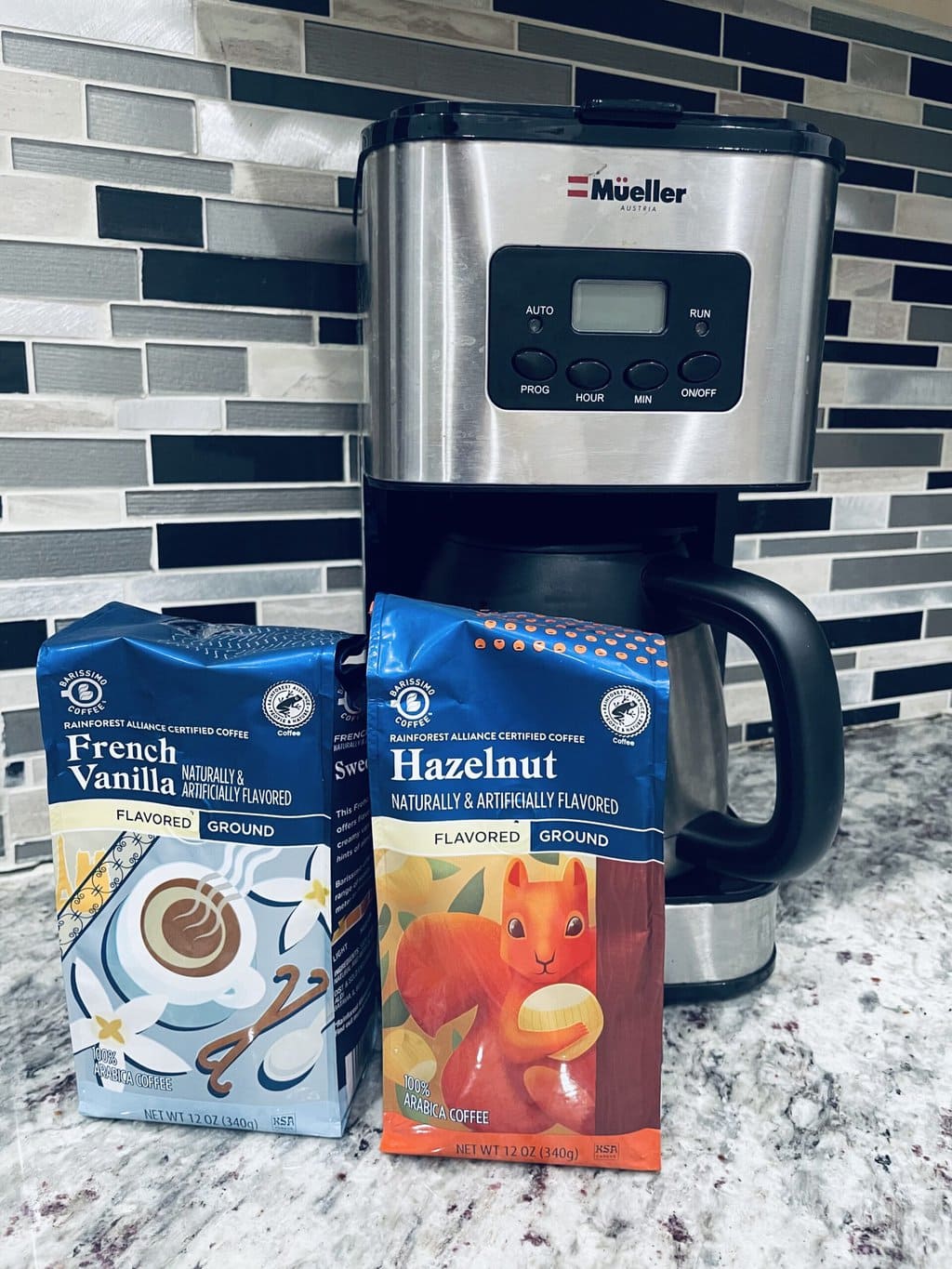 French vanilla and Hazelnut coffee packs from Aldi next to the Mueller coffee maker