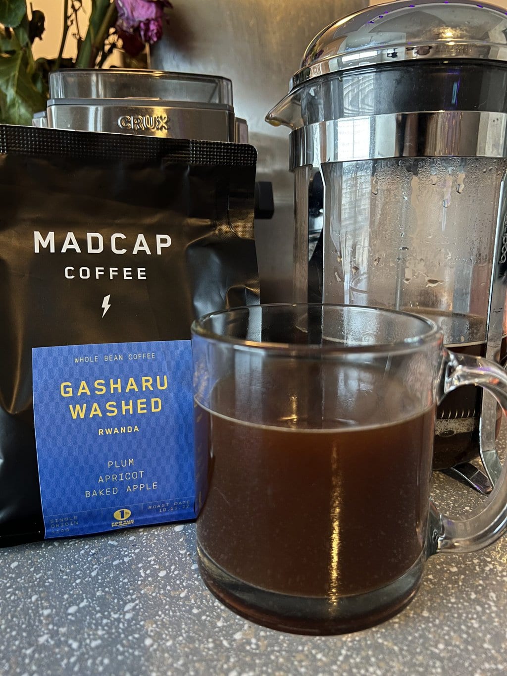 Gasharu Washed - Madcap coffee packaging with a brewed cup of coffee