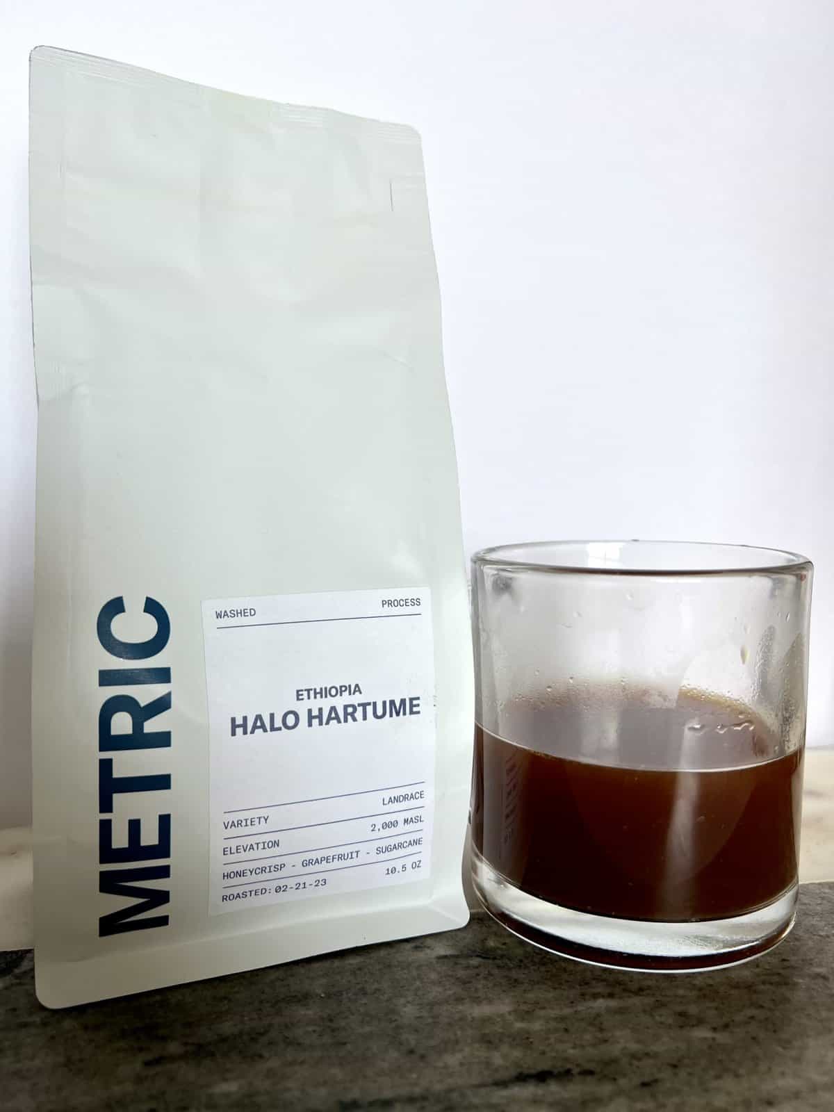 Fellow Coffee Subscription Review: Deliveries Designed To Educate 8 Metric-Coffee-packaging-stands-on-coffee-beans-scale