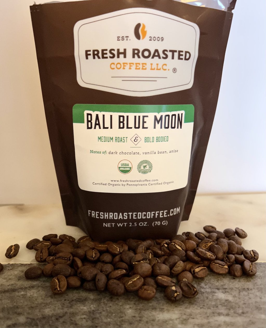 Fresh Roasted Coffee Subscription Review & Photos For 2024 22 Organic Bali Blue Moon next to coffee beans