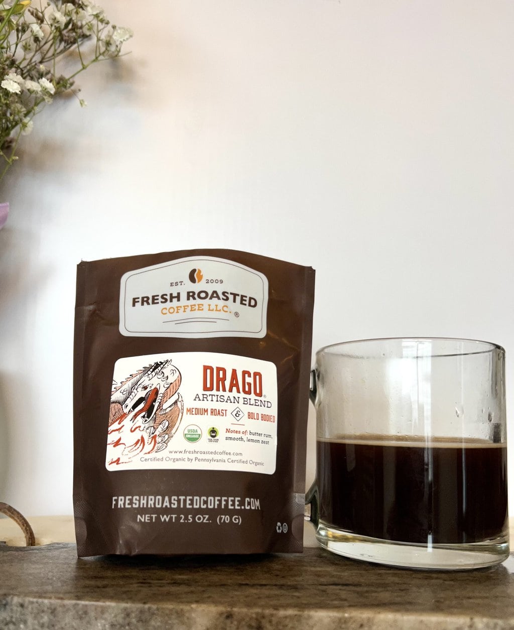 Fresh Roasted Coffee Subscription Review & Photos For 2024 31 Organic Drago next to a cup of coffee