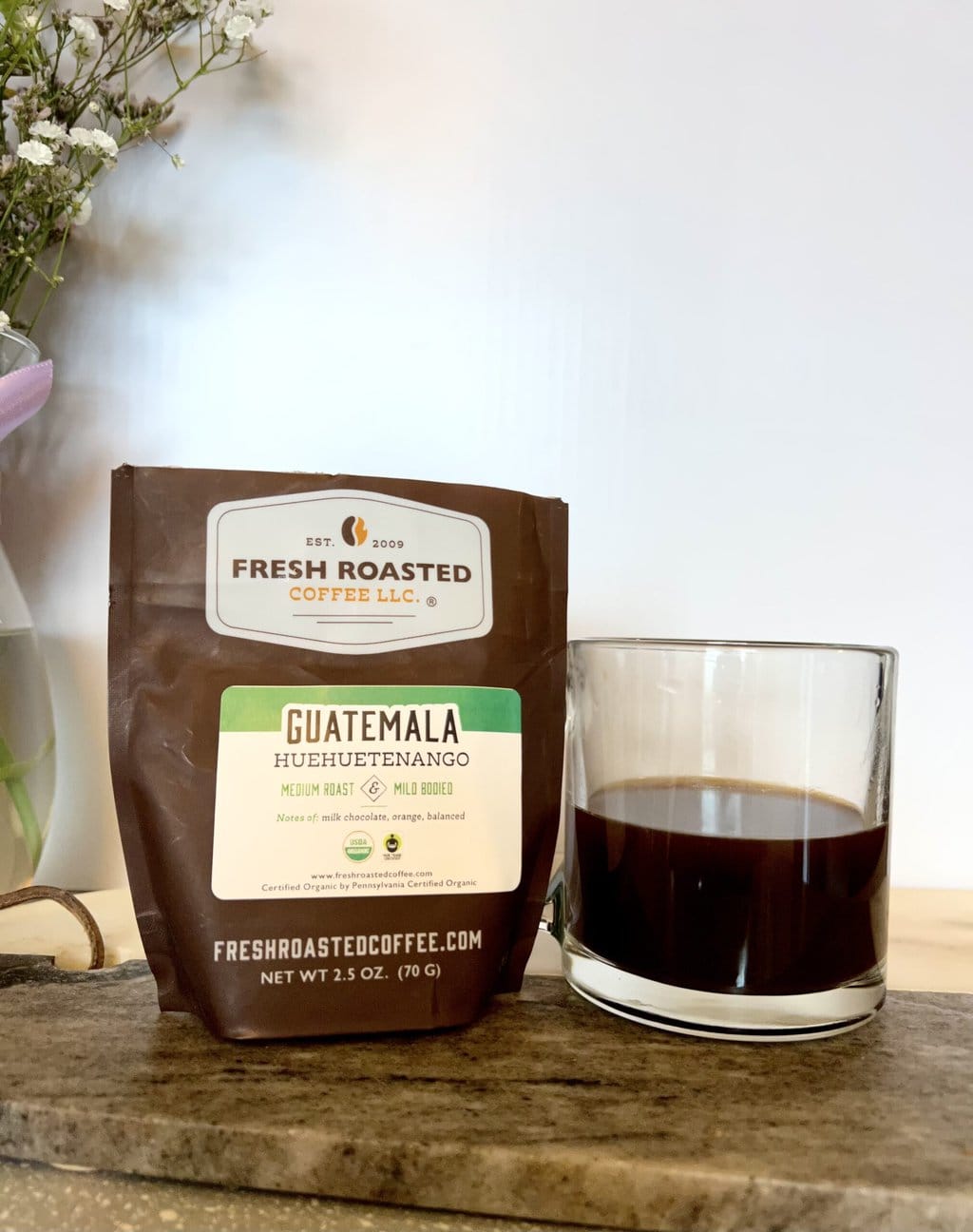 Fresh Roasted Coffee Subscription Review & Photos For 2024 19 Organic Guatemala Huehuetenango next to a cup of coffee