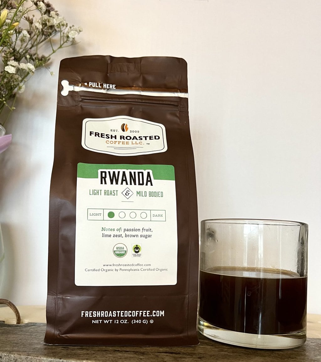Fresh Roasted Coffee Subscription Review & Photos For 2024 35 Organic Rwanda next to a cup of coffee