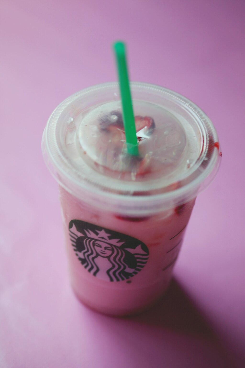 berry smoothie Starbucks in plastic cup with straw 