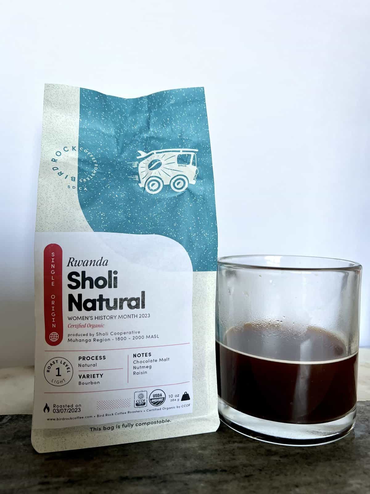 Fellow Coffee Subscription Review: Deliveries Designed To Educate 11 a-package-of-Bird-Rock-Coffee-stands-next-to-a-cup-of-brewed-coffee-scaled