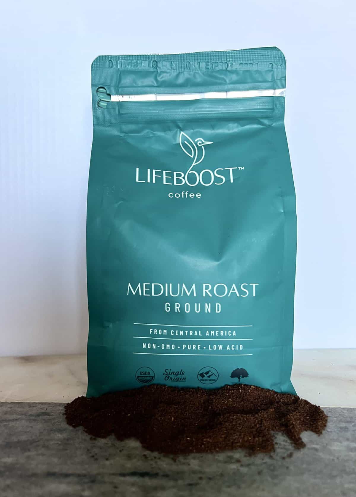 Lifeboost Coffee Brew & Review 12 an open package of Lifeboost Coffee Whole Bean Medium Roast Coffee next to the ground coffee