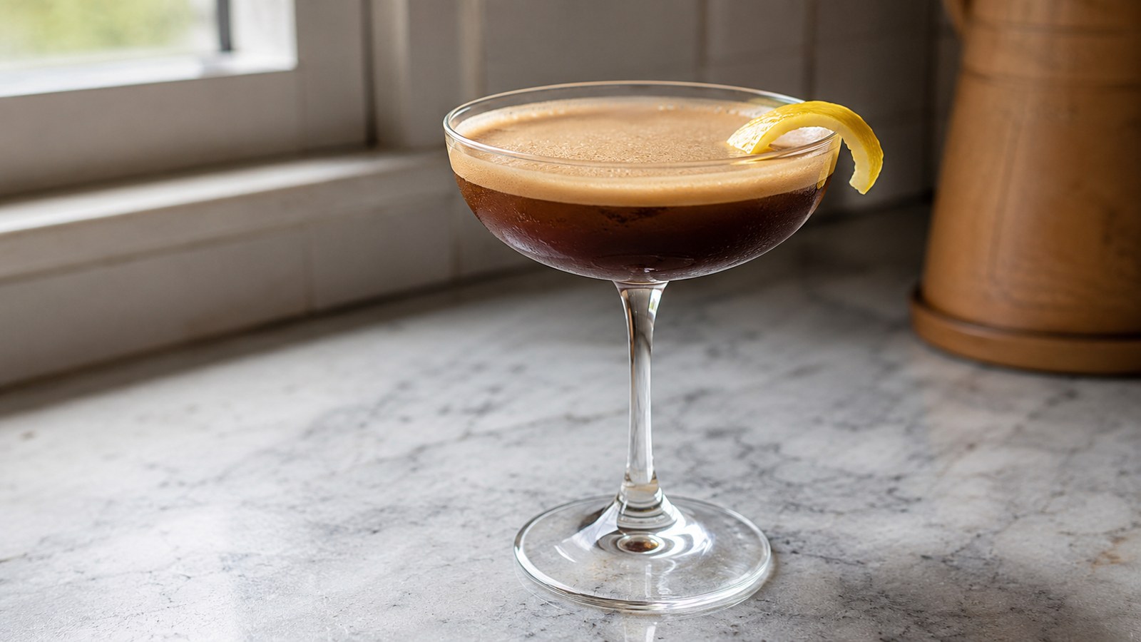 Bold Coffee Cocktails to Kick Off Labor Day Weekend 1 Espresso Martini with a Twist of Lemon