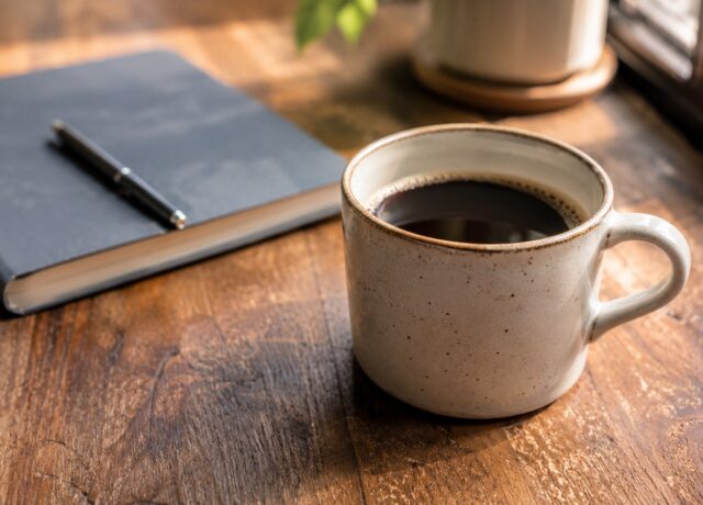 Generic coffee drink on a simple table for a coffee shops article