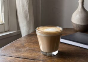 Generic coffee drink on a simple table for a coffee shops article