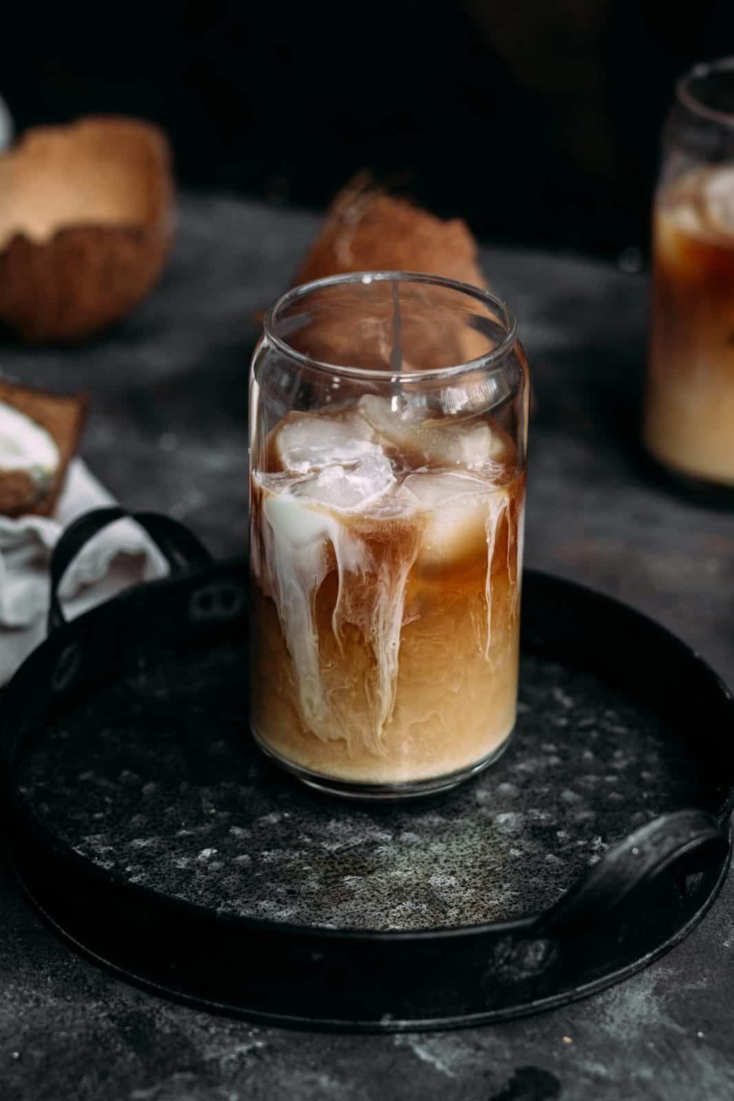Summer Iced Coffee Recipes Under 100 Calories That Still Taste Like a Café Treat 7 Iced coffee with a splash of coconut milk in a glass