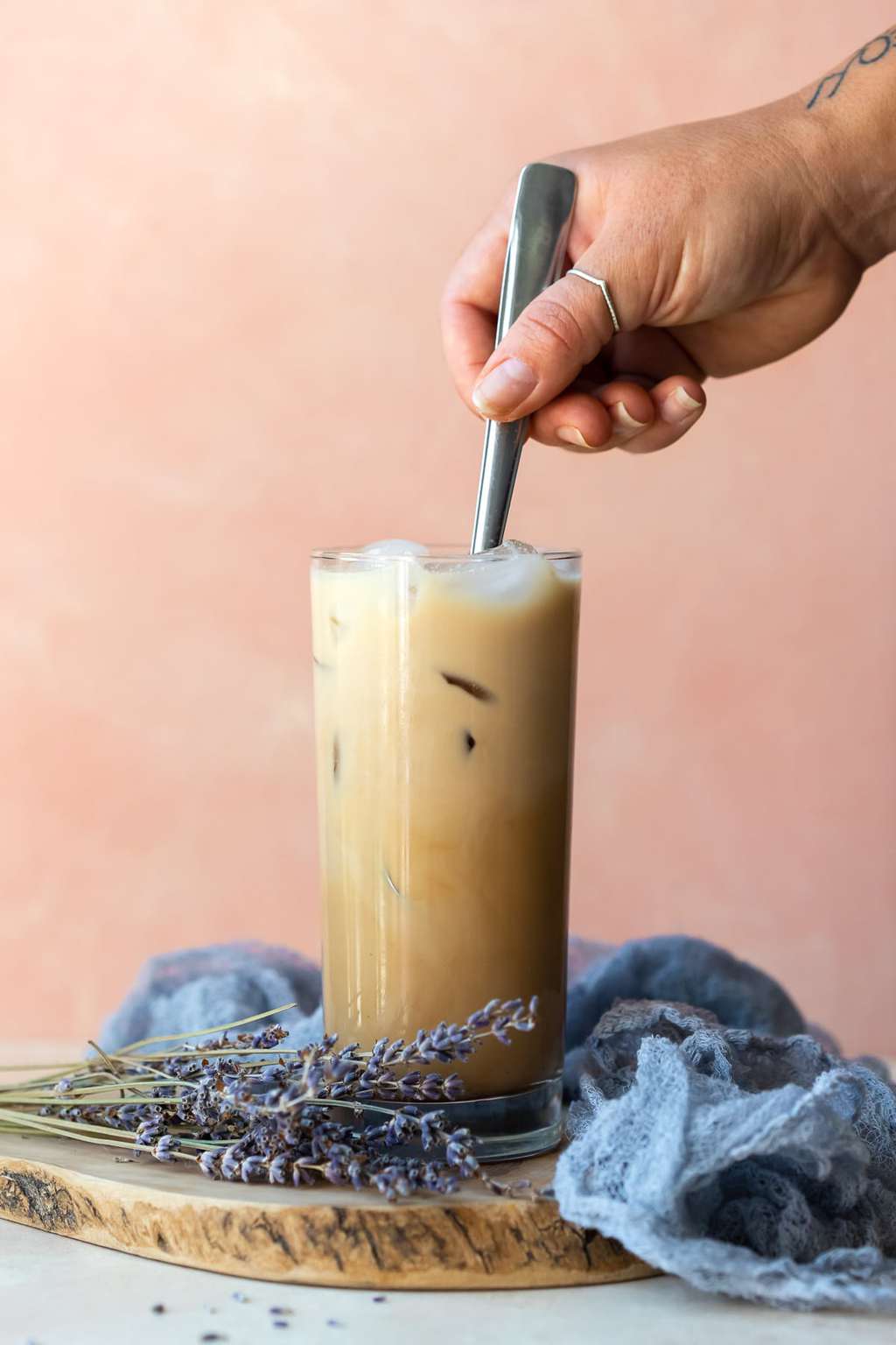 Summer Iced Coffee Recipes Under 100 Calories That Still Taste Like a Café Treat 5 Iced lavender latte in a tall glass with lavender sprigs