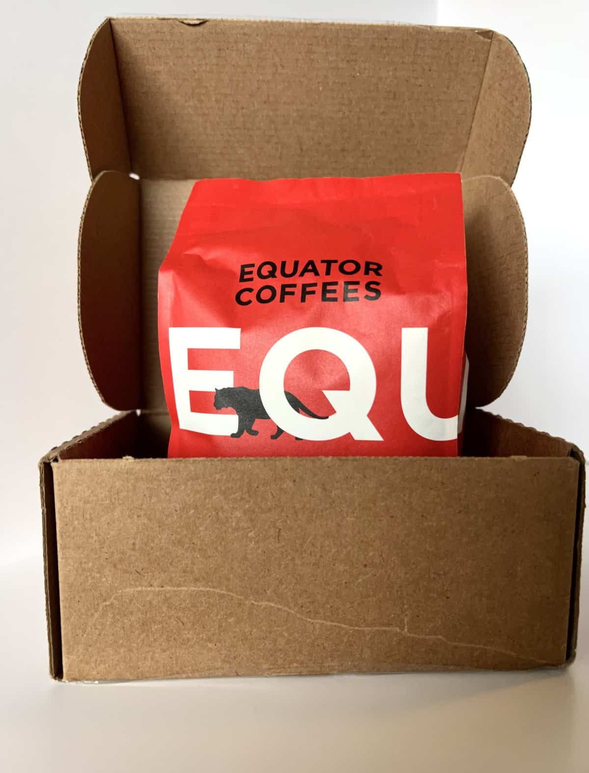 open box with pack of Equator Coffees inside