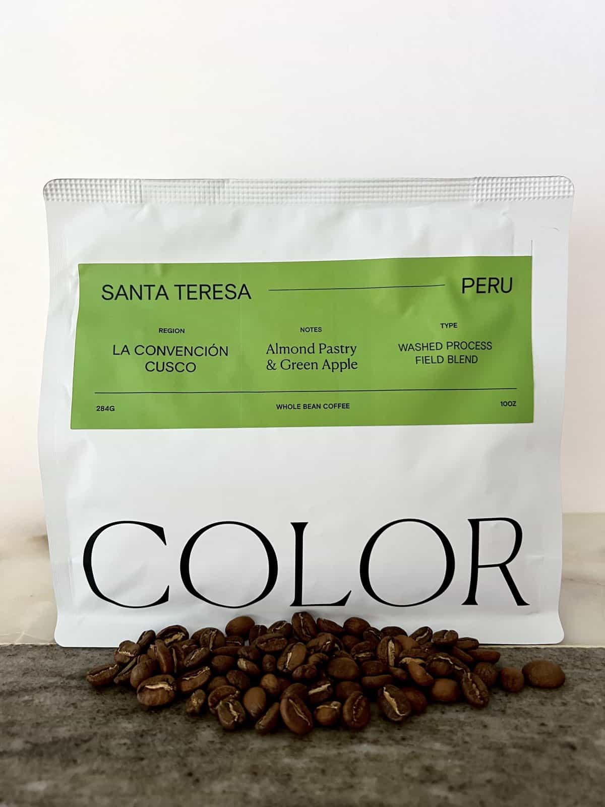 Color Coffee Roasters Subscription Review: Taste the Rainbow 7 packaging-Santa-Teresa-Peru-coffee-stands-on-coffee-beans-scaled