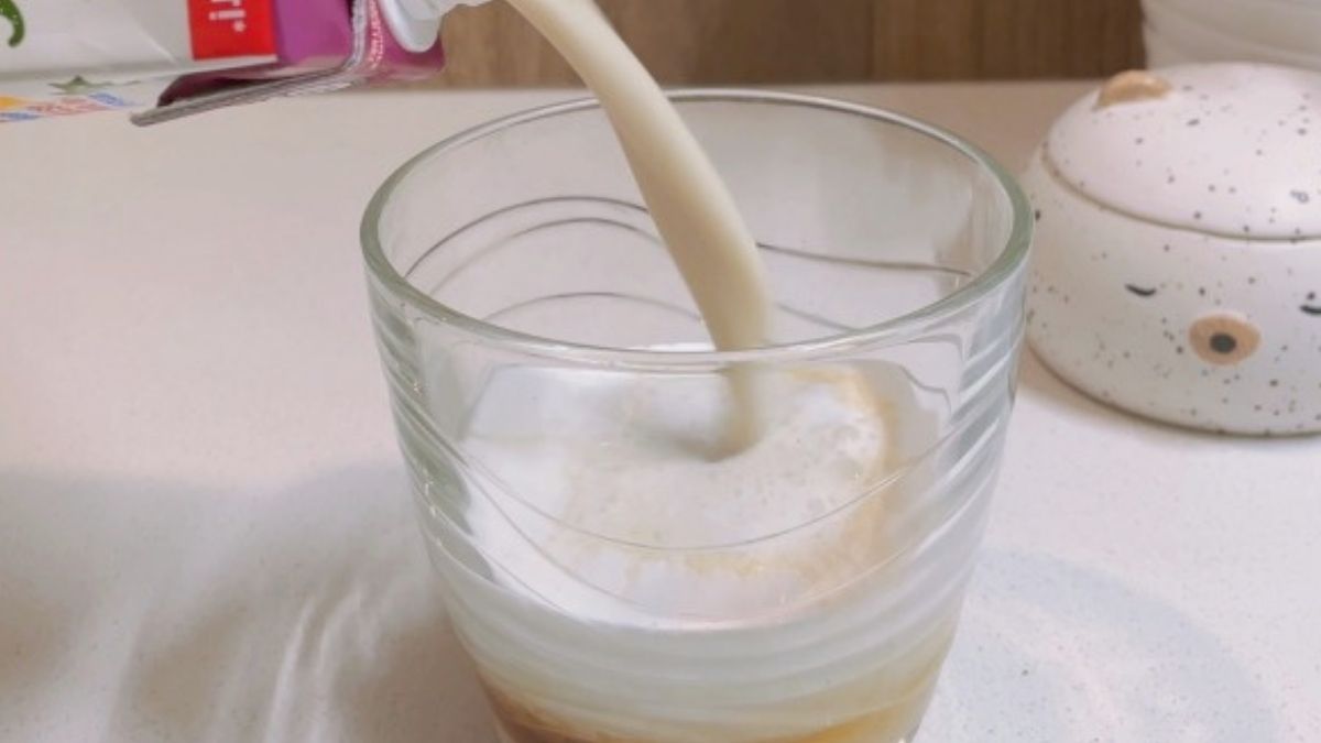 pouring creamer into glass