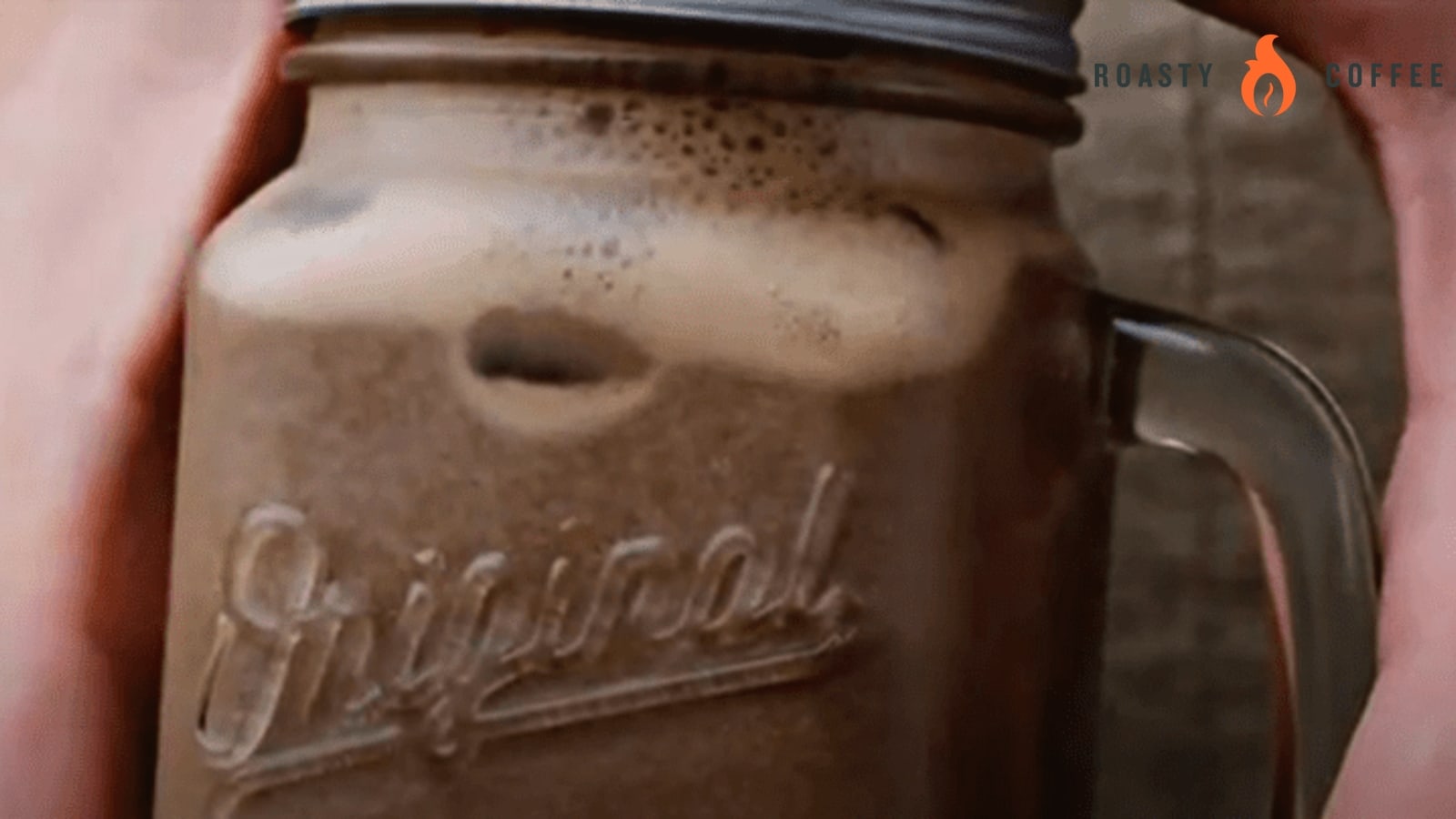 Ditch the Line: This Iced Mocha Recipe Is Better Than the Pros 5 shaking the jar with mocha